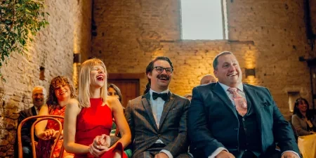 A photo of the guests at a wedding ceremony with Sam White Celebrant at Cripps Barn.