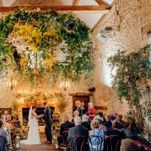 A photo of the guests at a wedding ceremony with Sam White Celebrant at Cripps Barn.